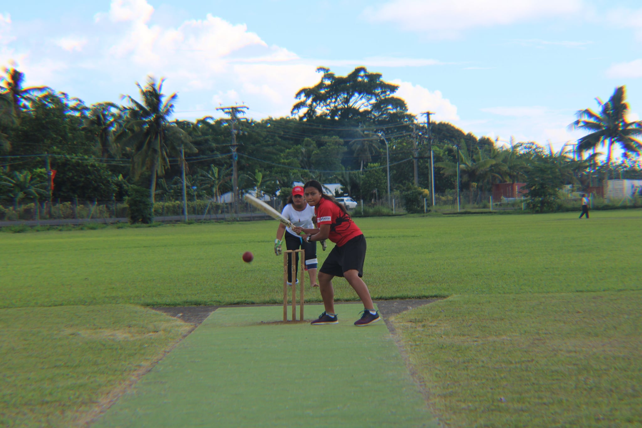 Samoan Boy in Red T-Shirt Batting