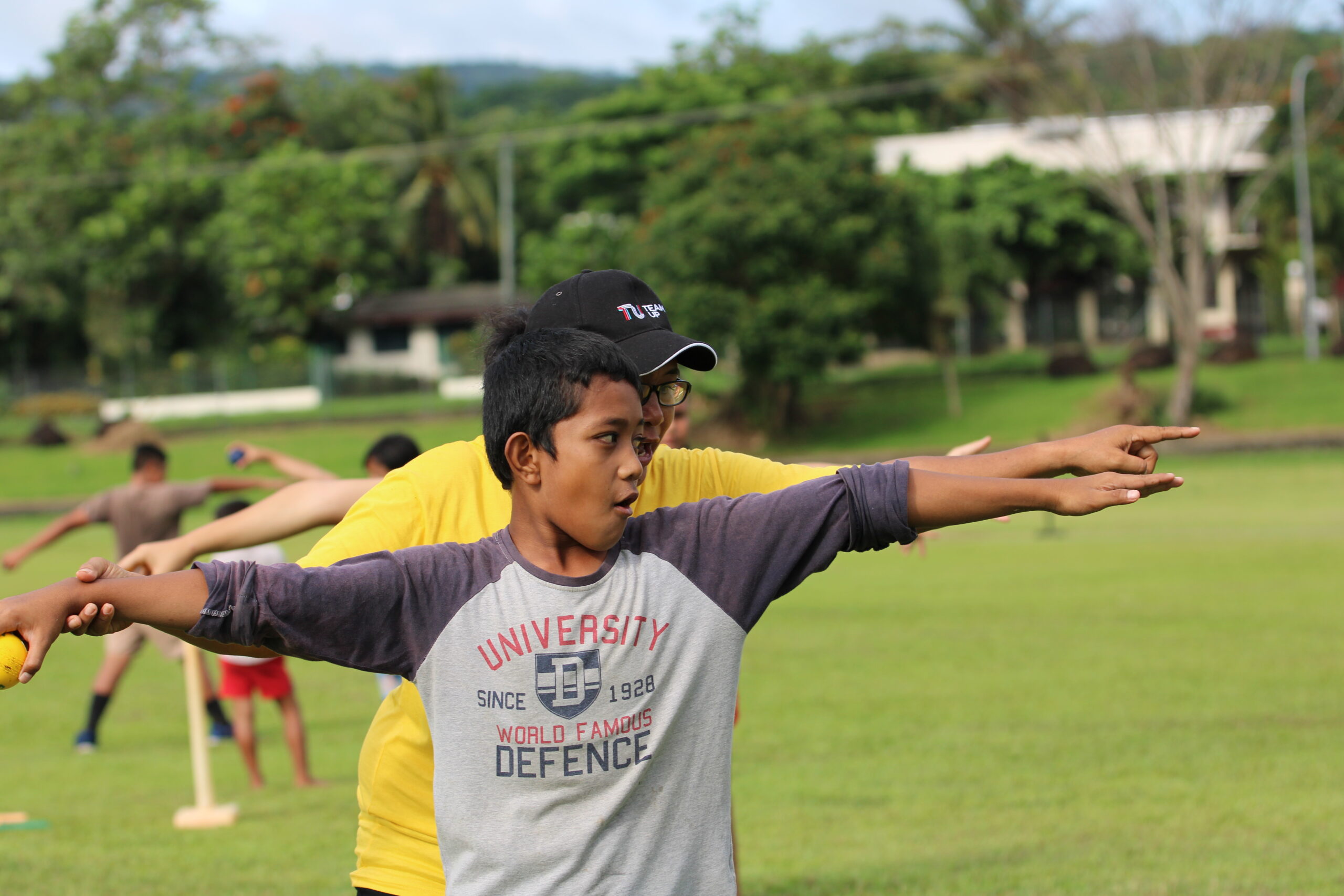 Samoan Boy in Red T-Shirt Batting