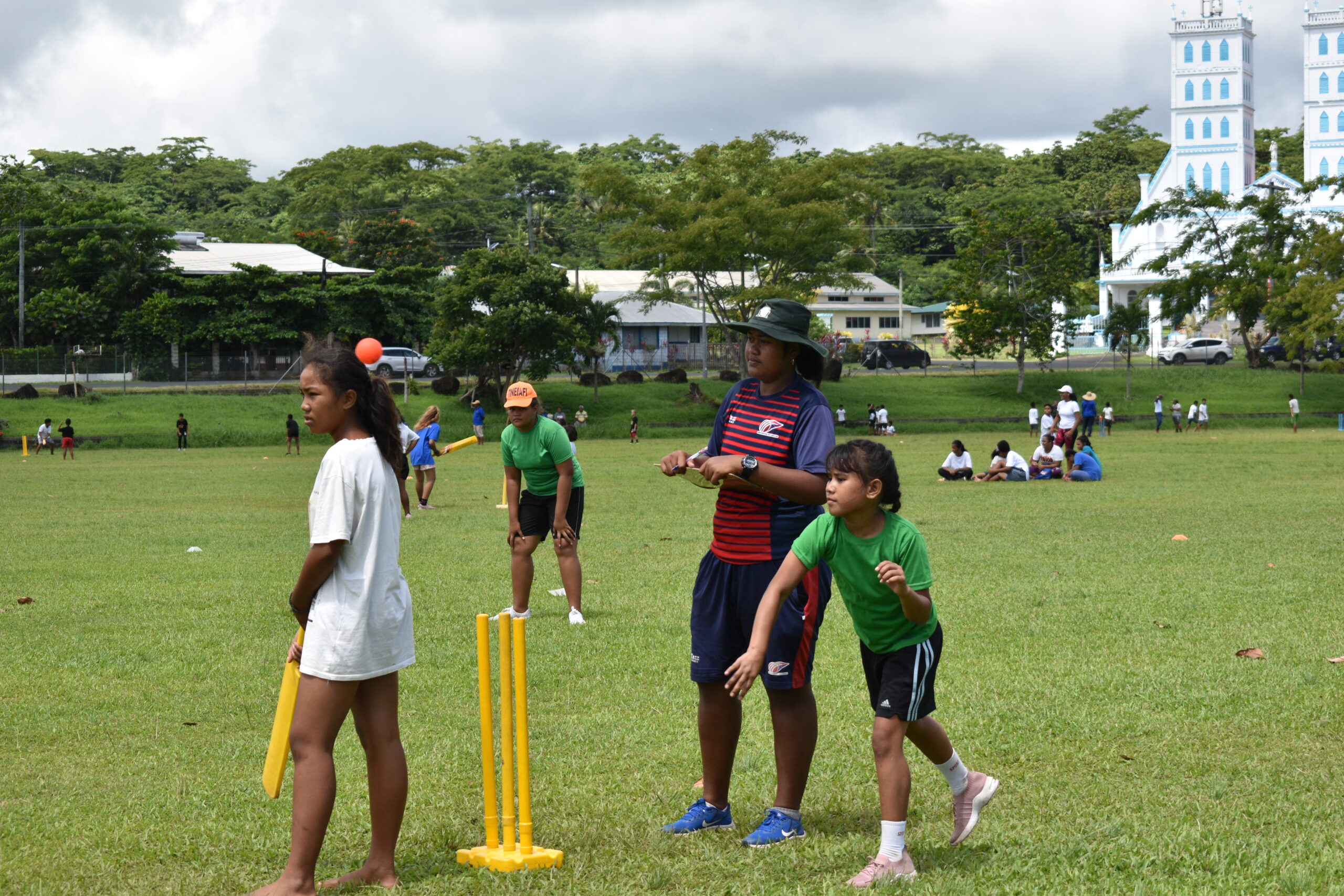 Samoan Boy in Red T-Shirt Batting